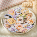 Collection of decorative patches on a white plate with a soft pink checkered fabric background.