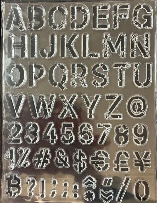 Metallic letter and number stamps on a reflective surface