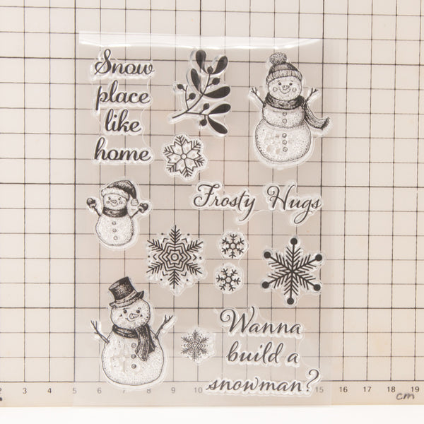 Decorative sheet with snowmen and snowflakes on a grid background