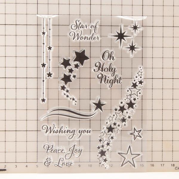 Decorative metal cutting dies with star designs and text on a grid background