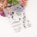 Clear stamp set with star designs and Christmas phrases on a white background with flowers.