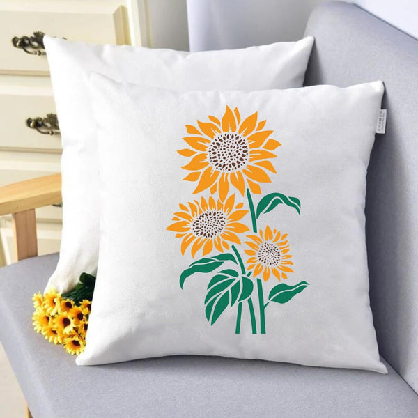 Decorative pillow with sunflower design on a gray chair
