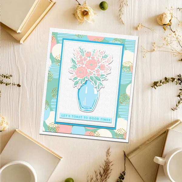 Decorative print with floral design on a wooden surface with books and flowers.