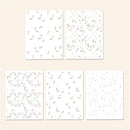 Set of five white cards with black abstract patterns on a beige background
