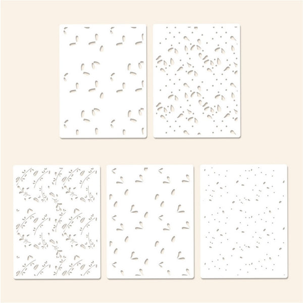 Set of five white cards with black abstract patterns on a beige background