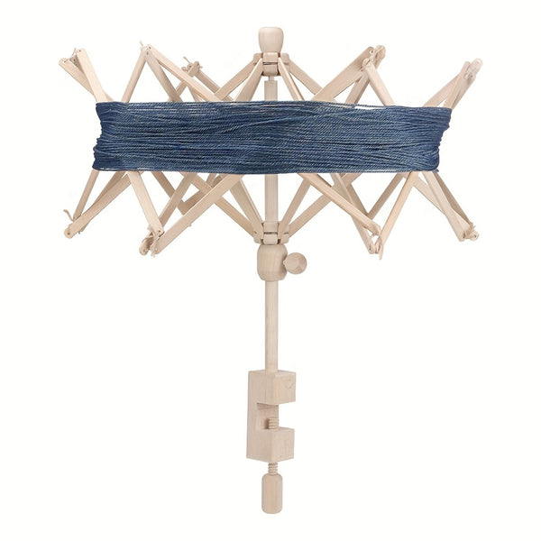 A wooden spindler or spinning wheel frame with a blue thread or yarn wrap around the horizontal arm, shown against a plain white background.