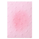 Pink textured paper with a subtle pattern on a white background