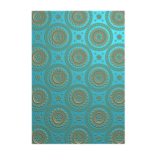 Patterned paper with decorative design on a blue background