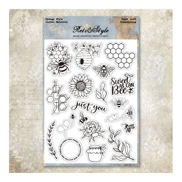 Sheet of clear stamps with bee and floral designs on a textured surface