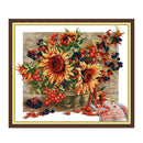 Framed artwork of sunflowers and berries on a textured background