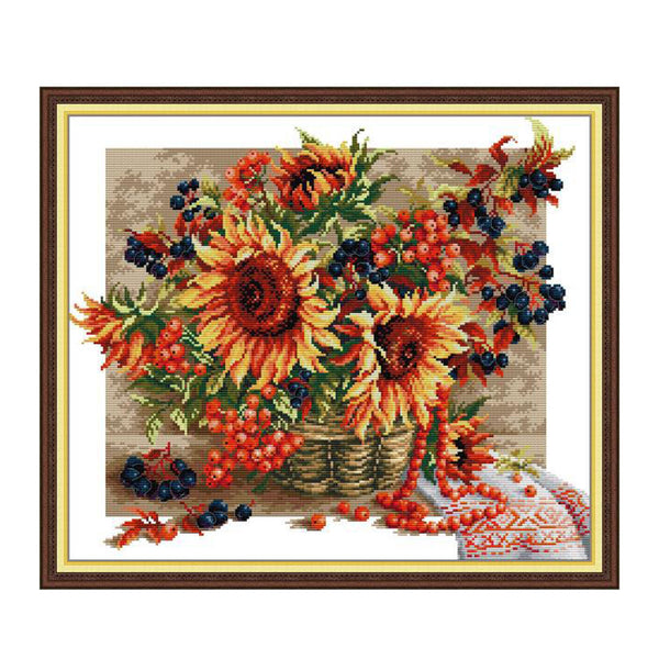 Framed artwork of sunflowers and berries on a textured background