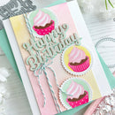 Handmade birthday card with cupcake decorations and 'Happy Birthday' text on a light background.