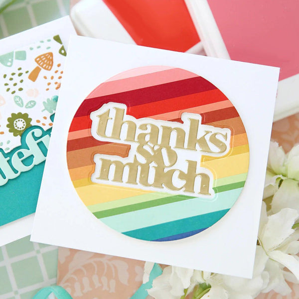 Colorful card with 'thanks & much' text on a floral background