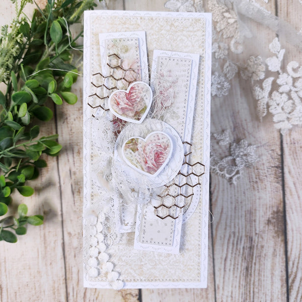 Decorative card with floral elements on a wooden surface