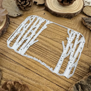Metal die cutters with tree branch design on a wooden surface