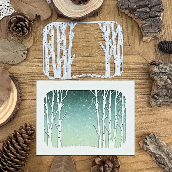 Wooden die-cut with tree design on a wooden surface with pinecones and wood slices.