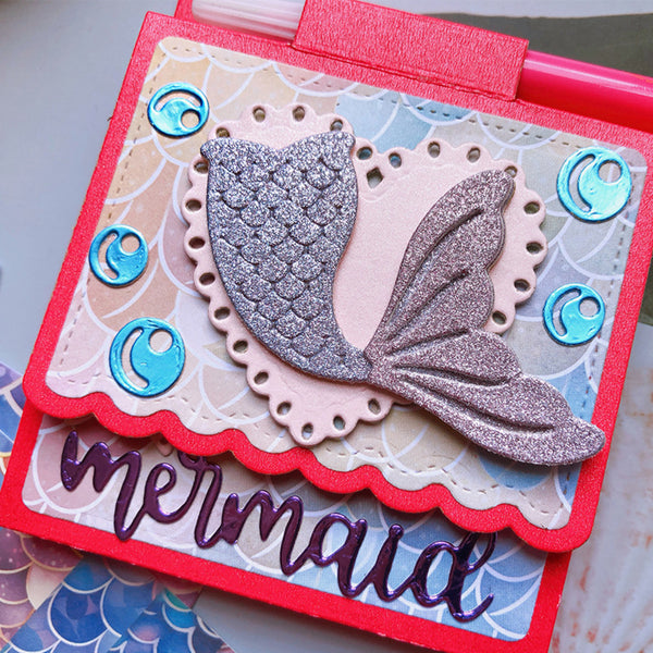 Card with a mermaid tail design and 'mermaid' text on a decorative background