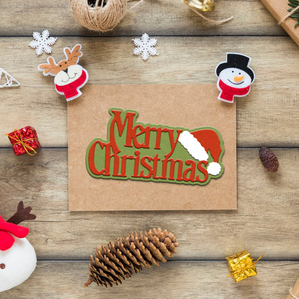 Merry Christmas card with decorative elements on a wooden surface