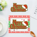Decorative 'Merry Christmas' sign with a Santa hat on a white surface.