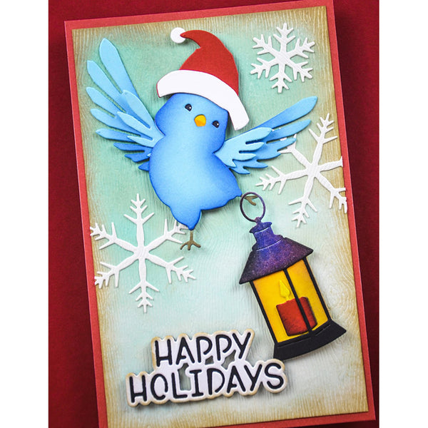 Holiday card with a blue bird wearing a Santa hat, snowflakes, and a lantern with 'Happy Holidays' text.
