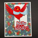 Card with a red bird wearing a blue scarf and floral border, featuring 'hello winter' text.