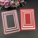 Two decorative paper frames, one pink and one red, on a dark surface with flowers in the background.