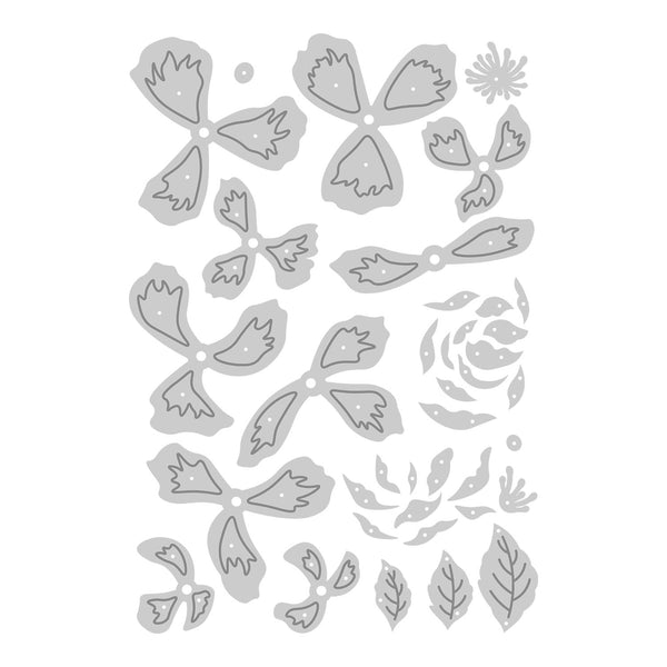 Set of floral and leaf metal dies on a white background