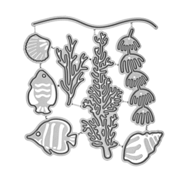 Set of metal cutting dies shaped like fish, coral, and shells on a white background