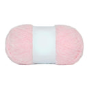 Pink yarn ball with a white label on a white background