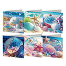 Six square greeting cards arranged in two rows on a white background, each featuring a colorful seashore scene with shells, starfish, pearls, and ocean waves.