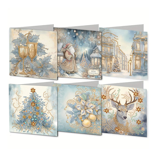 Six Christmas-themed square cards arranged in two rows on a white background. The designs feature gold and blue winter motifs including goblets, a Santa figure, illuminated buildings, a decorated tree, ornaments, and a deer.