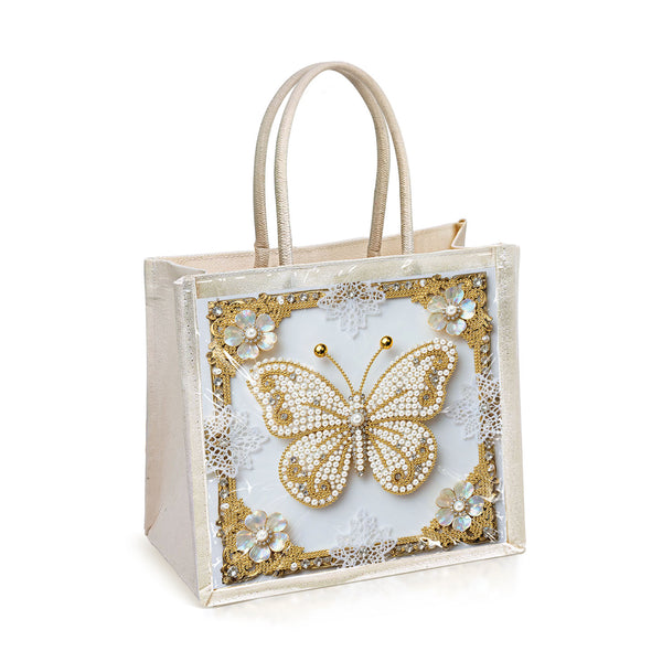 Decorative tote bag with a gold butterfly design on a white background