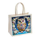 Tote bag with a decorative owl design on a blue background
