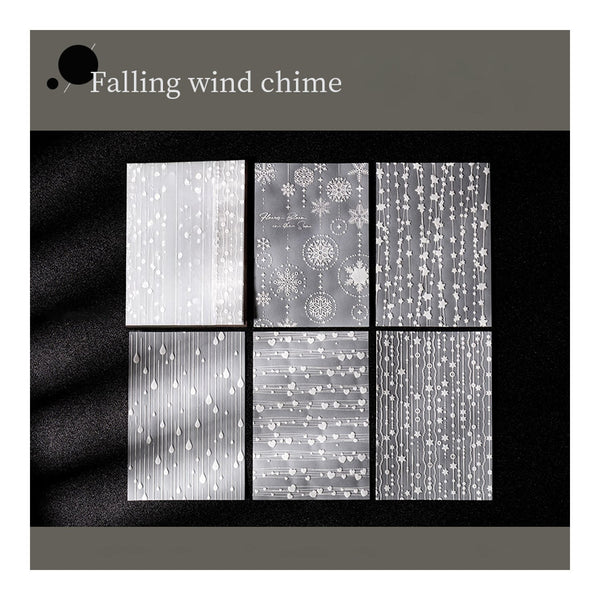 Falling wind chime design with decorative patterns on a black background