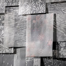 Decorative paper with snowflake patterns on a textured surface