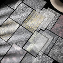 Collection of various metallic foil sheets with different patterns and textures.