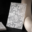 Floral patterned paper on a black background