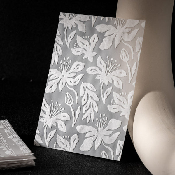 Floral patterned paper on a black background