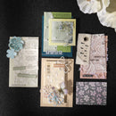 Collection of decorative cards and tags with floral and text designs on a black background
