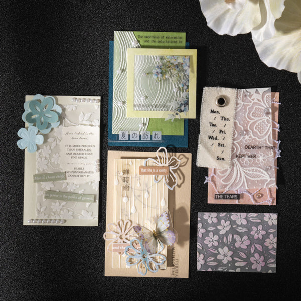 Collection of decorative cards and tags with floral and text designs on a black background