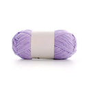 Ball of purple yarn with a white label on a white background