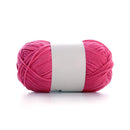 Pink ball of yarn with a white label on a white background