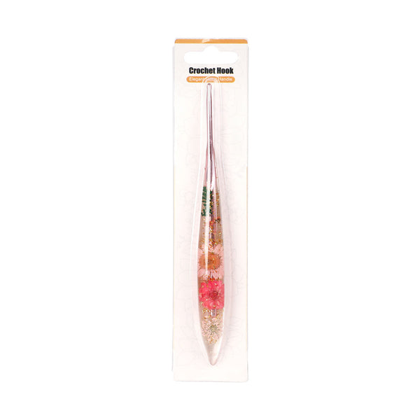 Crochet hook with floral design in packaging on a white background
