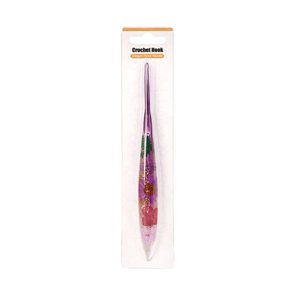 Crochet hook with decorative handle in packaging on a white background