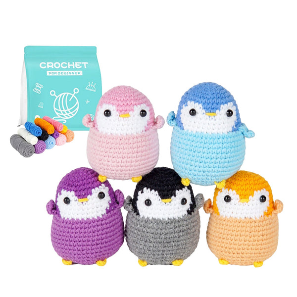 Five colorful crocheted penguin toys with a crochet hook set on a white background