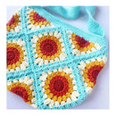 Colorful crocheted bag with geometric pattern on a white background