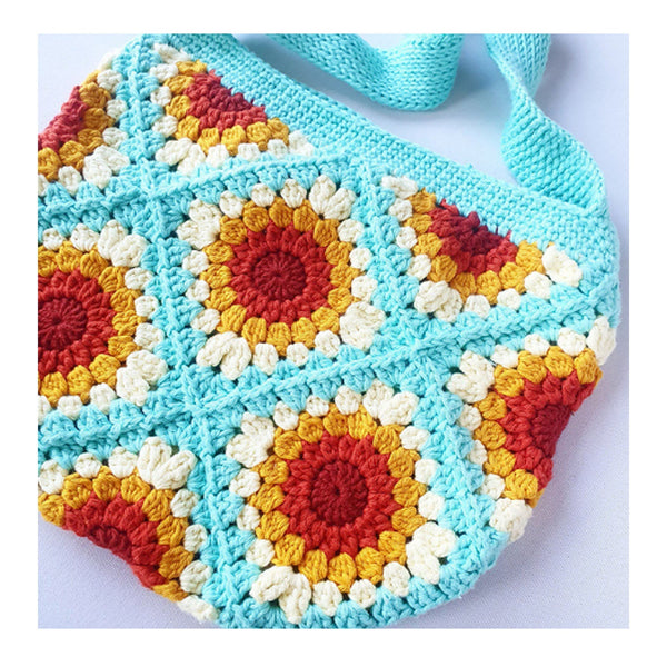 Colorful crocheted bag with geometric pattern on a white background