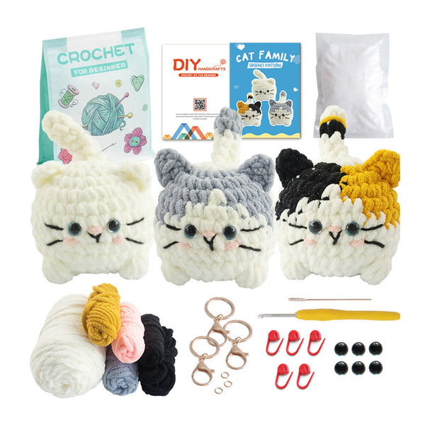 Crochet cat family kit with yarn, hooks, and instructions on a white background