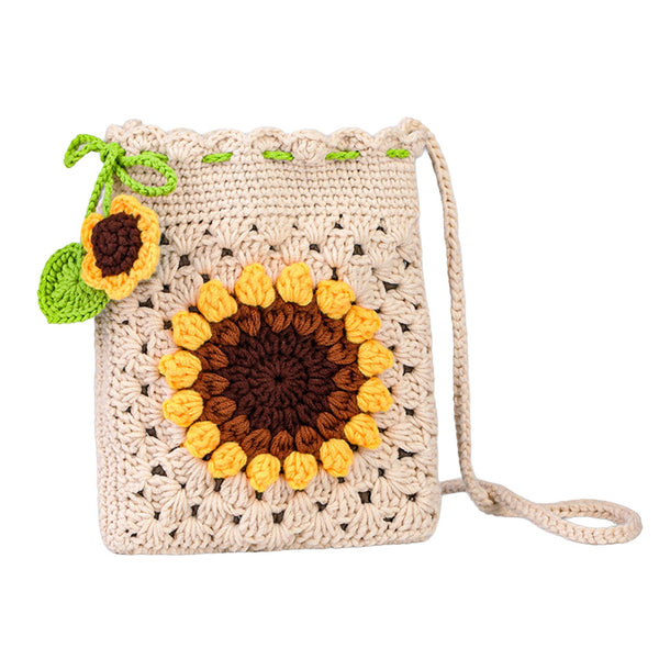 Crocheted sunflower bag with a strap on a white background