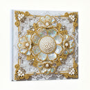 Decorative card with floral embellishments and pearl details on a white background
